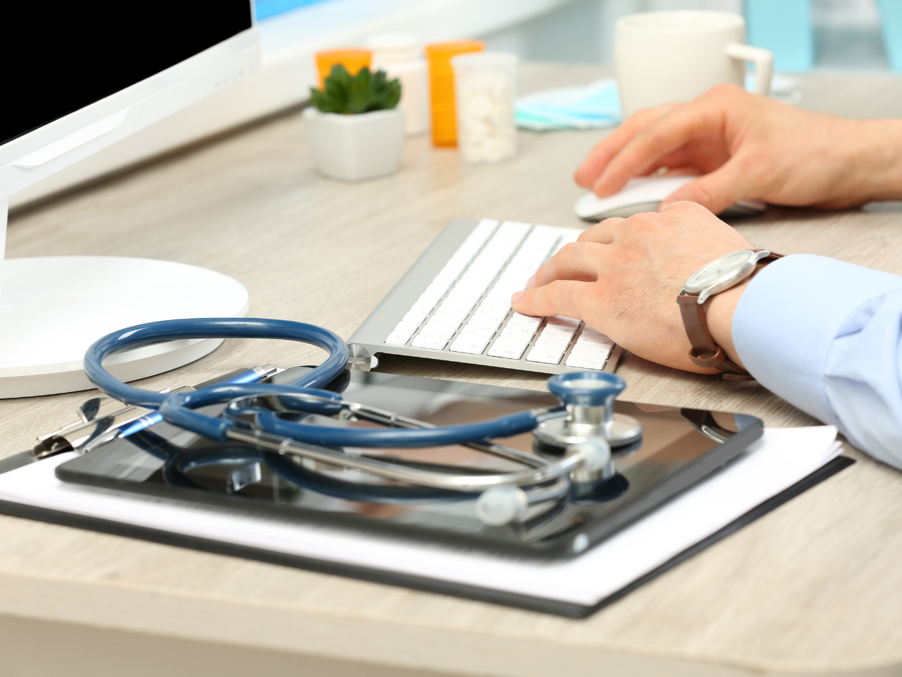 Doctor Working at Table in Office