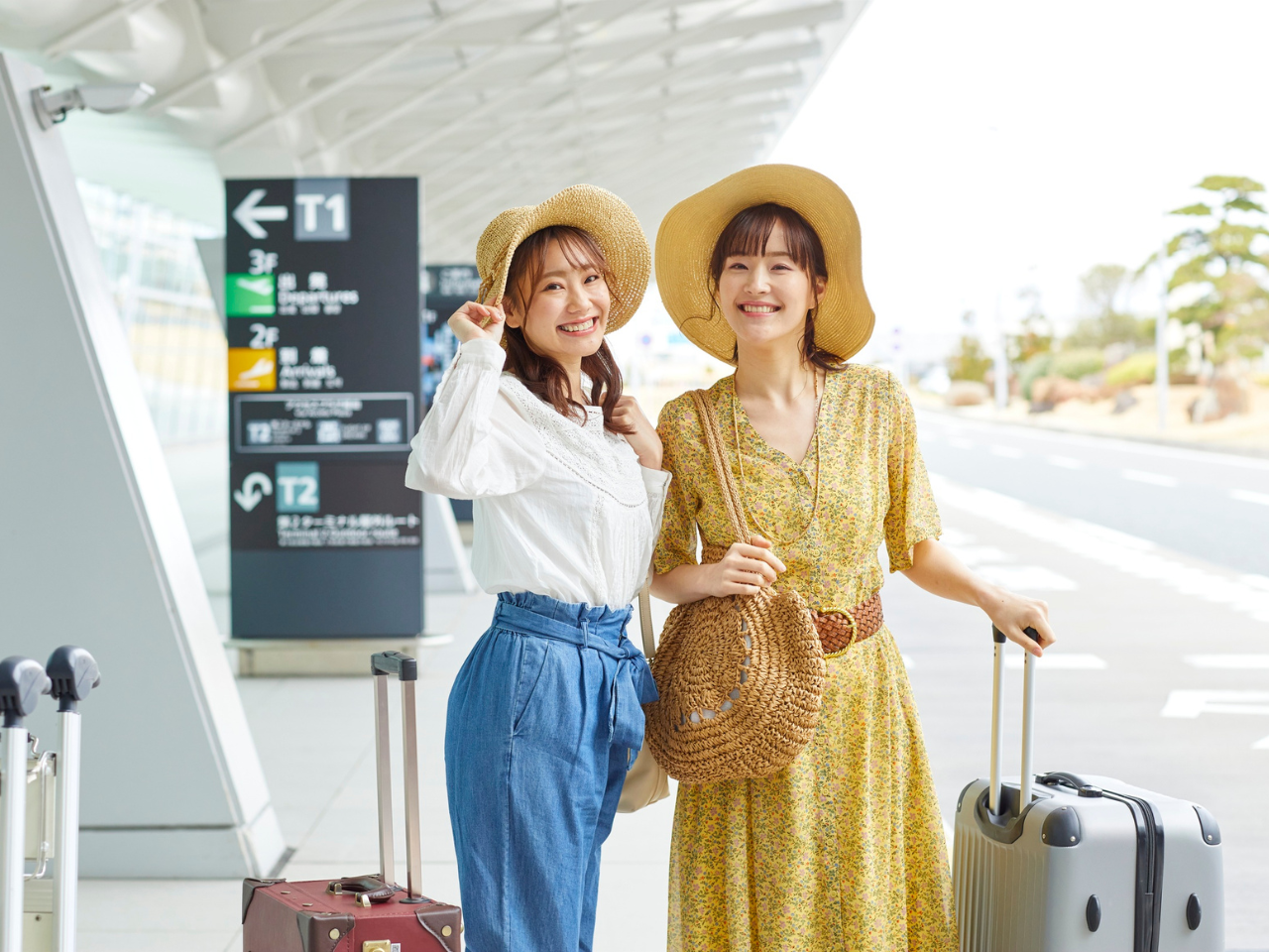 Women Traveling at the Airport with Luggage